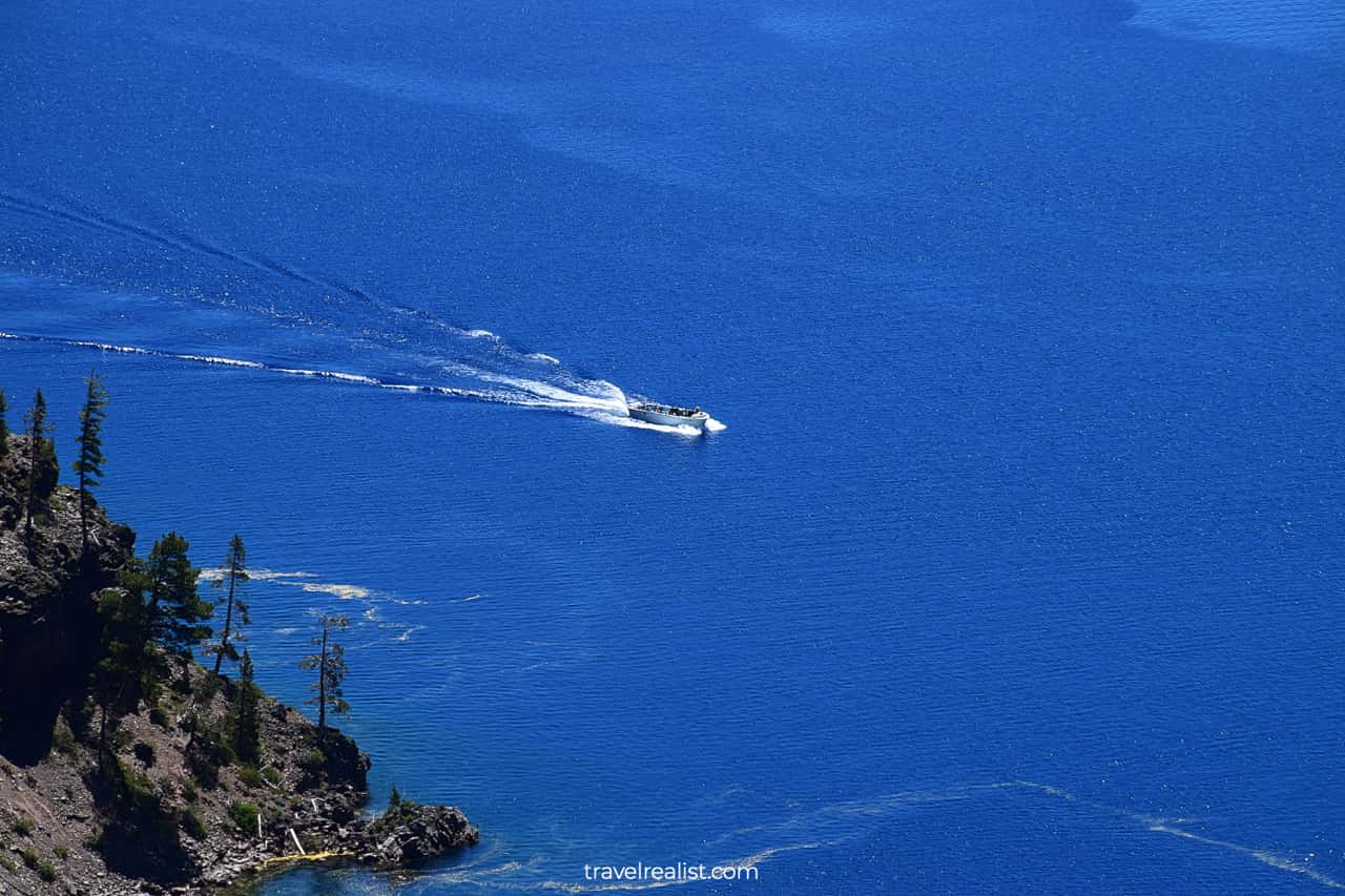 Boat on lake in Crater Lake National Park, Oregon, US