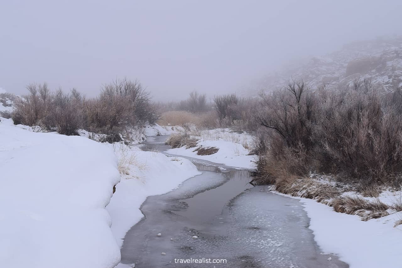 Frozen creek at Wolf Ranch in Arches National Park, Utah, US