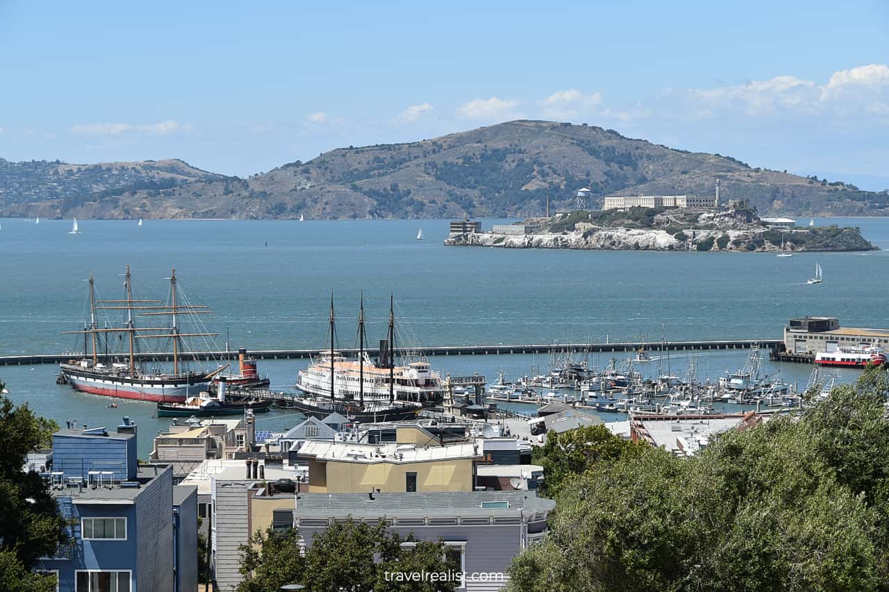 Historic ships at San Francisco Maritime National Historic Site and Alcatraz Island as seen from Hyde Street in San Francisco, California, US