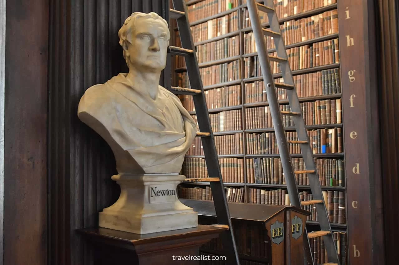 Newton bust and books at Book of Kells Library in Dublin, Ireland