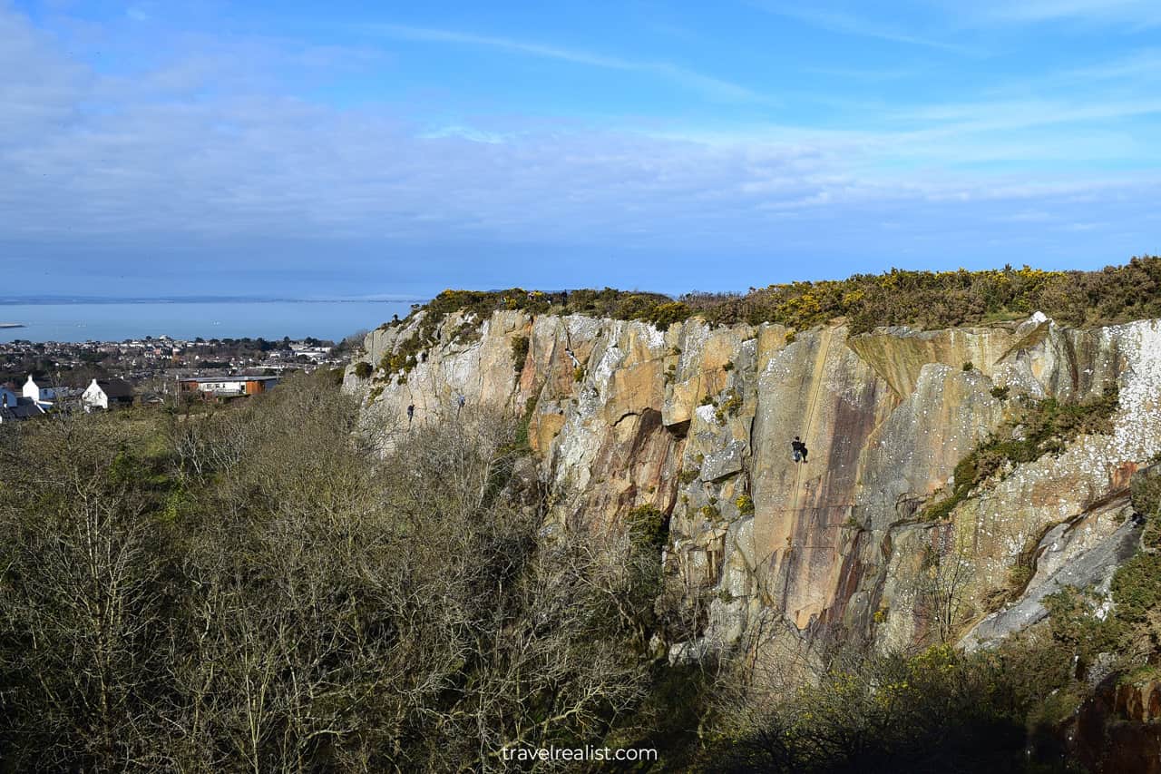 Climber on slopes of Dalkey Quarry in Dublin, Ireland