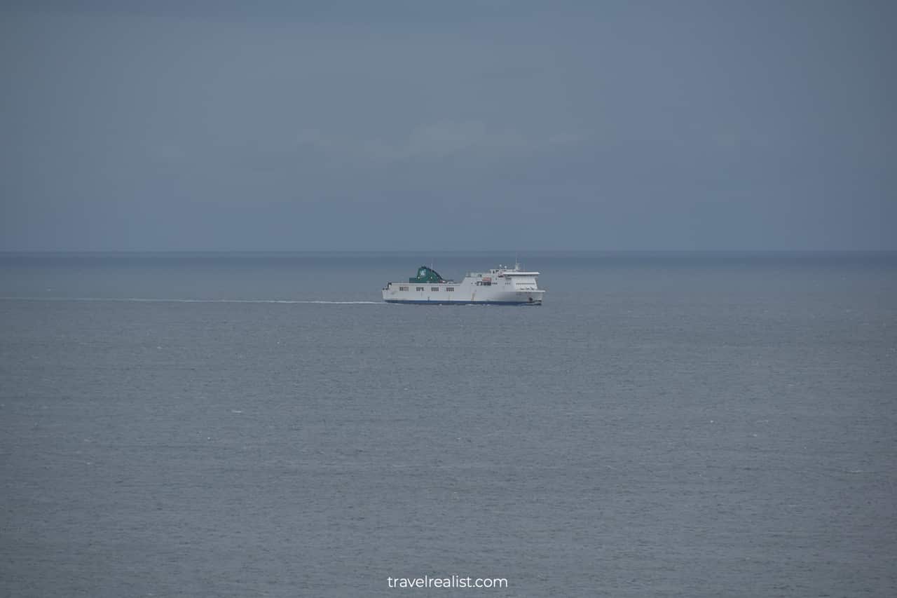 Ferryboat in Dublin Bay spotted from Howth Cliff Walk near Dublin, Ireland