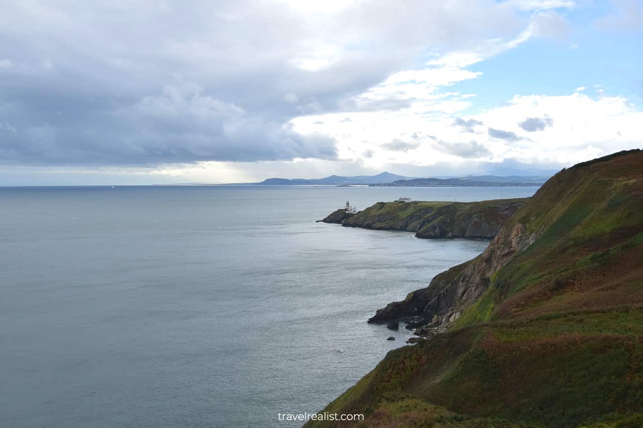Baily Lighthouse and Dublin Mountains from half point of Howth Cliff Walk in Ireland