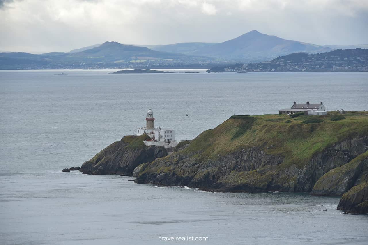 Baily Lighthouse and Dublin Mountains in background from Howth Cliff Walk in Ireland
