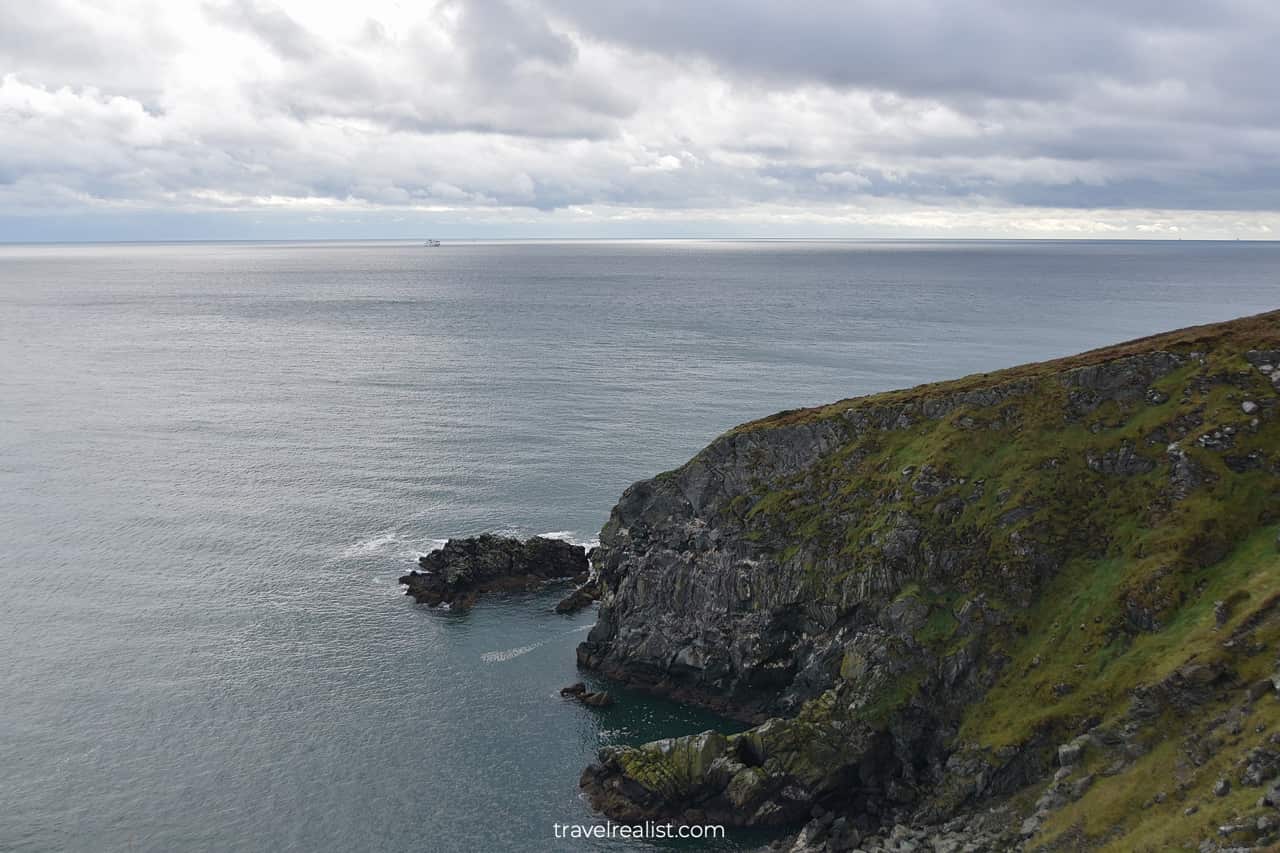Howth peninsula cliffs and ferryboat near Dublin, Ireland