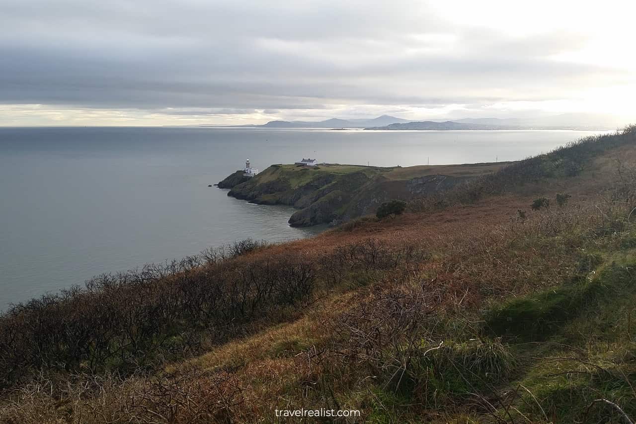 Baily Lighthouse and Dublin Mountains in the distance viewed from Howth Cliff Walk