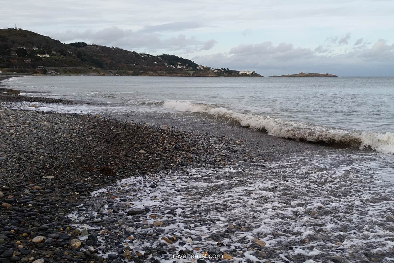 Breaking waves and Dalkey Island views from Killiney beach in Dublin, Ireland