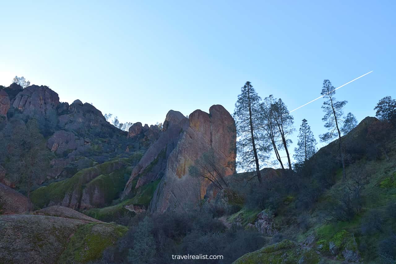 Plane flying over cliffs in Pinnacles National Park, California, US