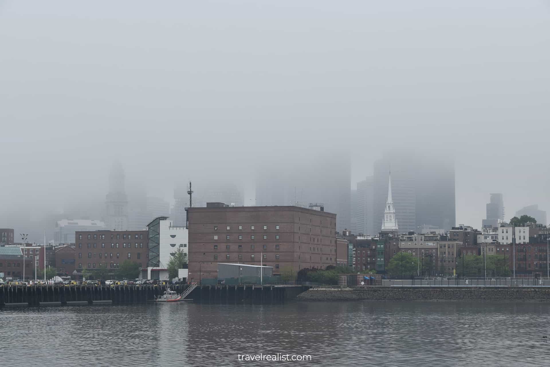 Boston skyline in fog at Charlestown Navy Yard in Boston, Massachusetts, US