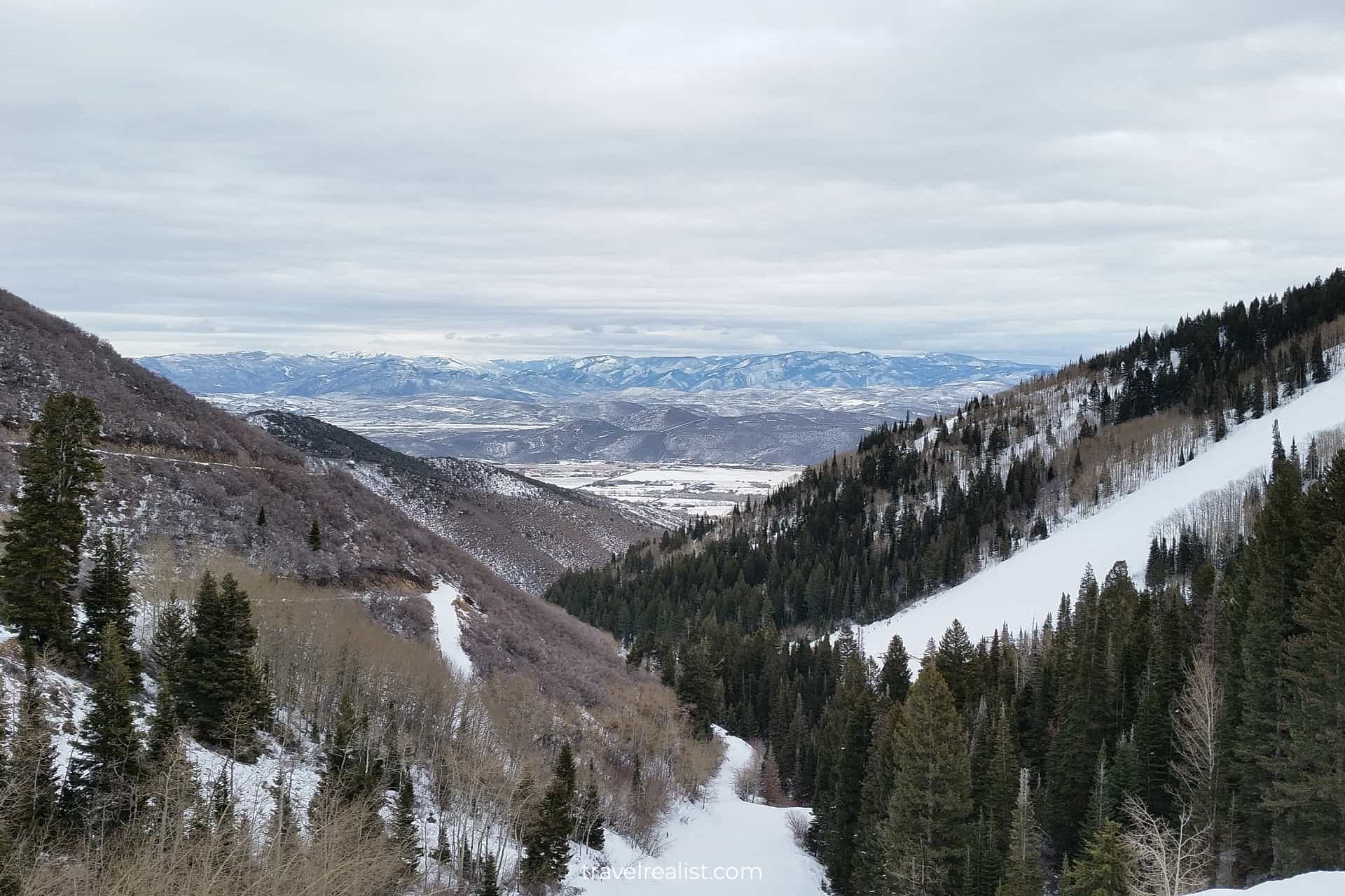 Ski trail with Park City in distance below in Park City, Utah, US