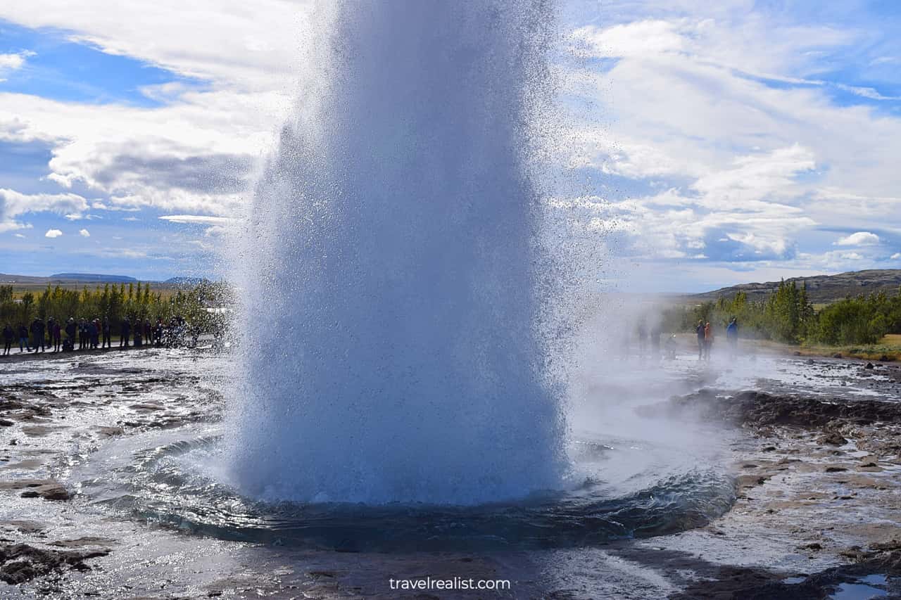 Strokkur geyser eruption on Golden Circle map in Iceland