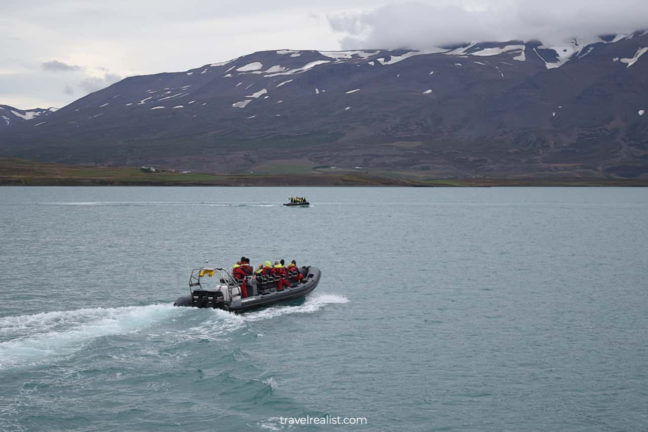 Boats looking for whales on whale watching Iceland tour in Akureyri