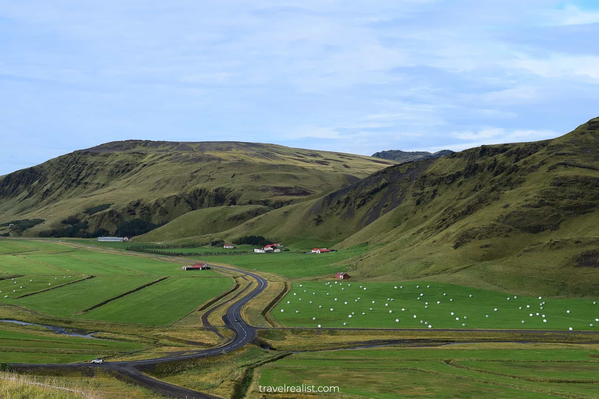 Hay rolls on fields near Ring Road and Vik, a budget friendly village in South Iceland