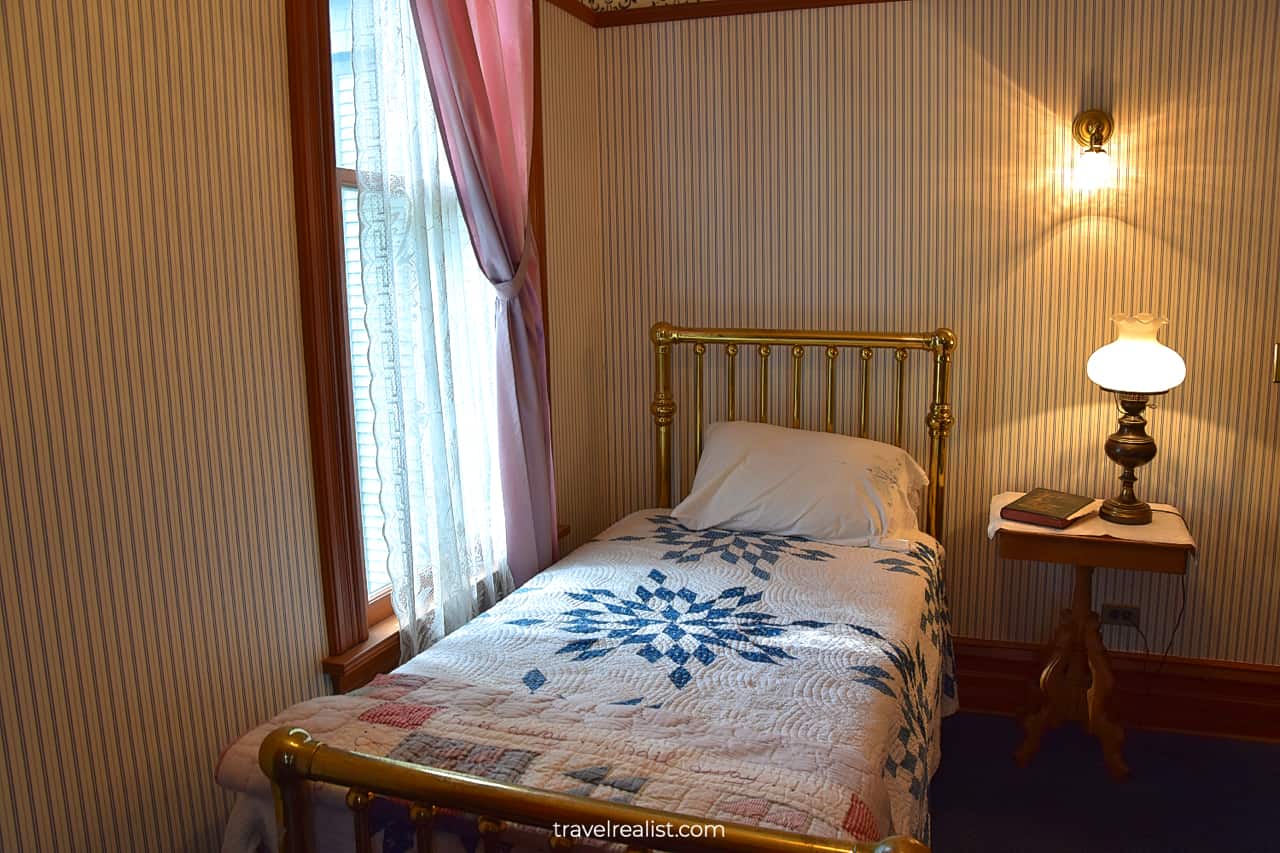 Bed and nightstand in Ernest Hemingway Birthplace Museum, Oak Park, Illinois, US