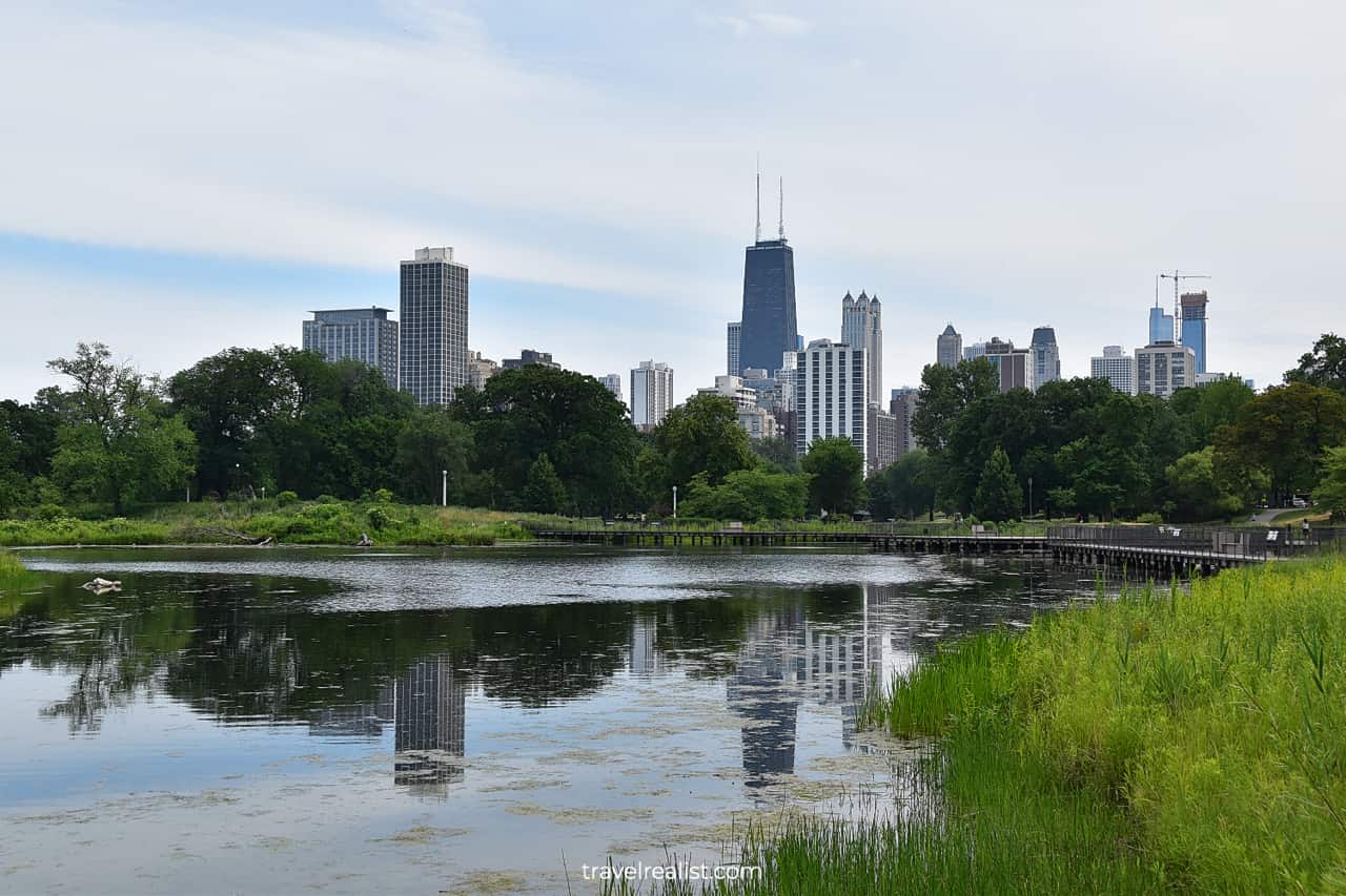 Chicago Skyline reflections in South Pond in Lincoln Park, Chicago, Illinois, US