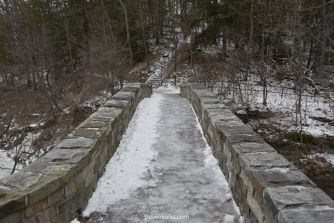 Crossing frozen Sackett Foot Bridge in Ithaca, New York, US