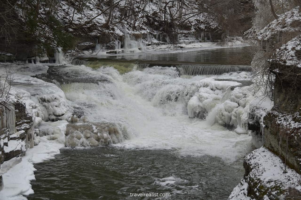 Roaring water and frozen creek banks in Ithaca, New York, US