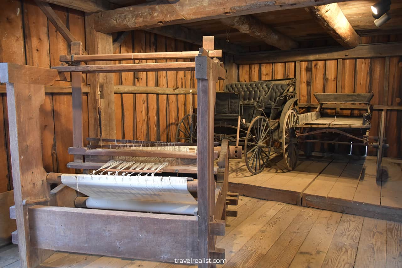 Carriages and frame loom in Display Barn in Ball's Falls Conservation Area, Lincoln, Ontario, Canada