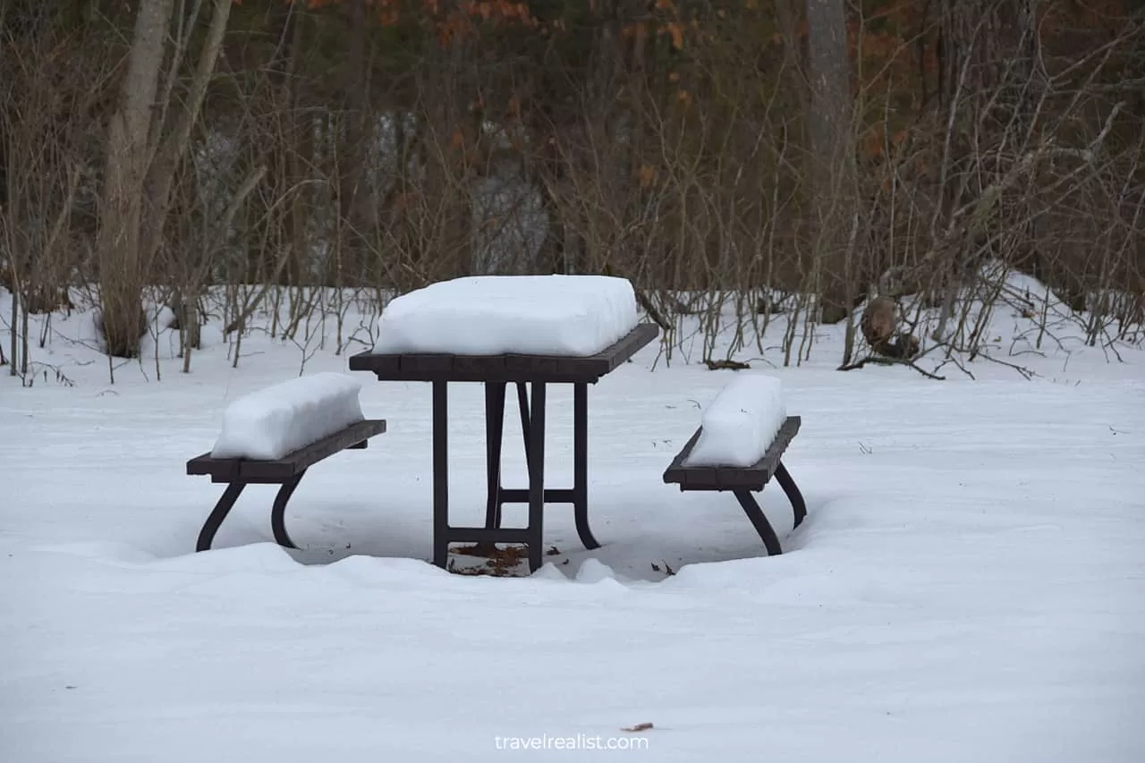 Snow on picnic table in Ferris Provincial Park in Ontario, Canada