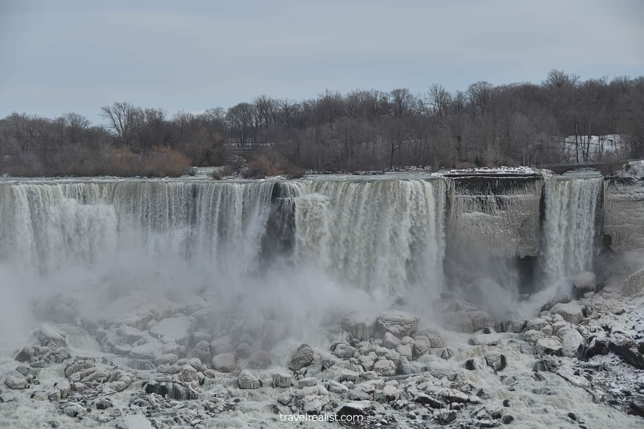 Frozen American Falls and Bridal Veil Falls from Fallsview Trail in Niagara Falls, Ontario, Canada