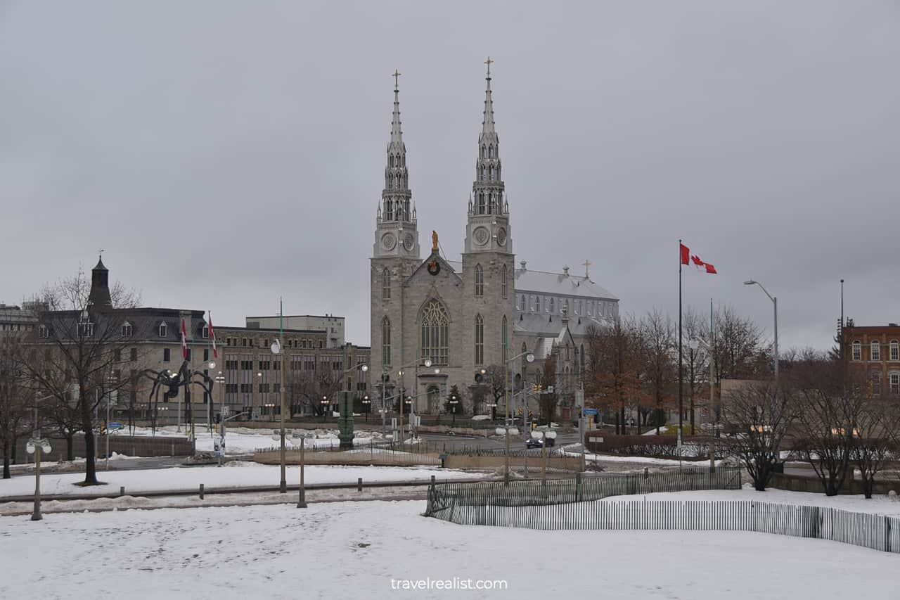 Notre Dame Cathedral Basilica and Canadian flag in Ottawa, Ontario, Canada