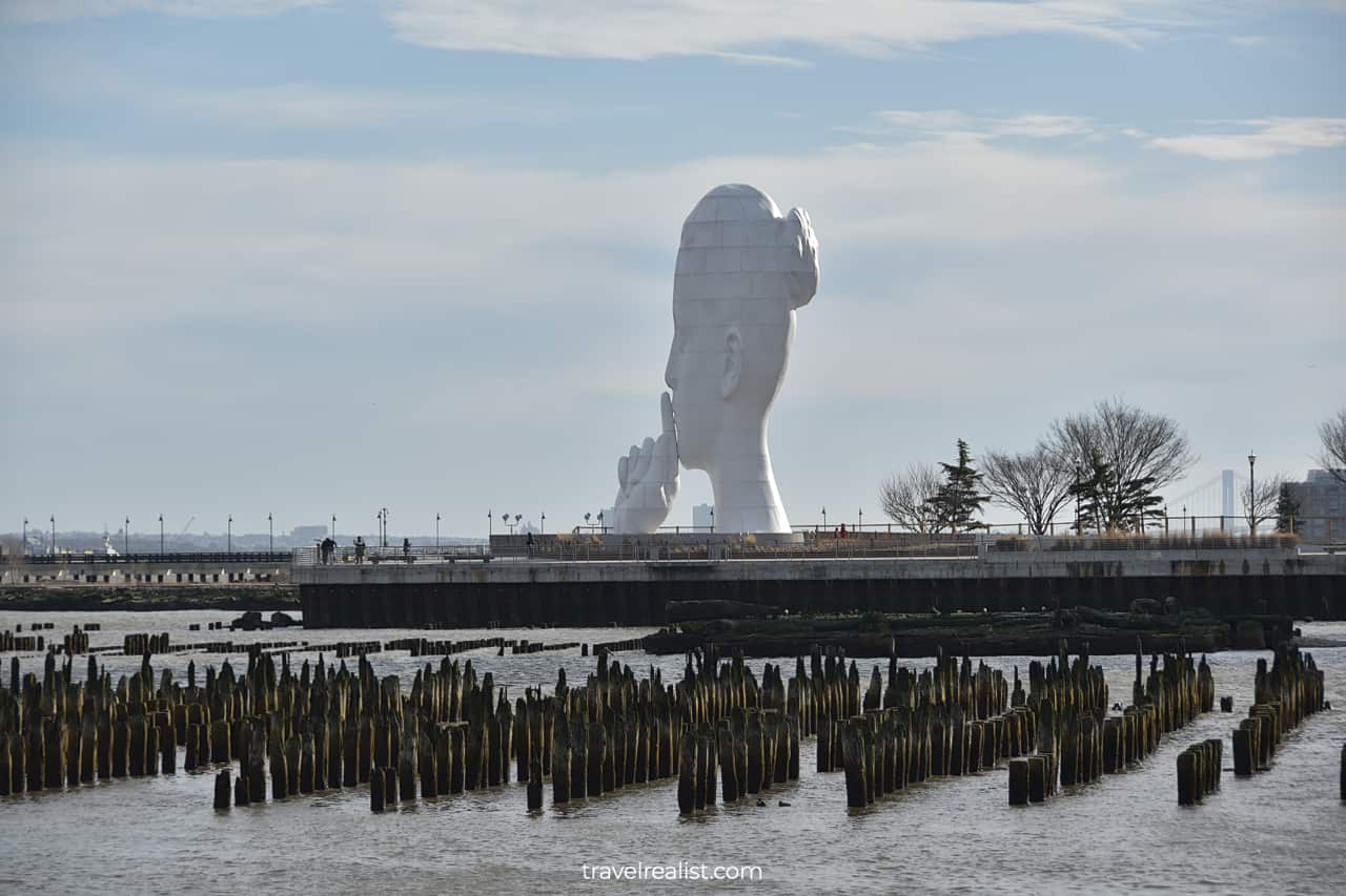 Old pier and Water's Soul statue in Jersey City, New Jersey, US