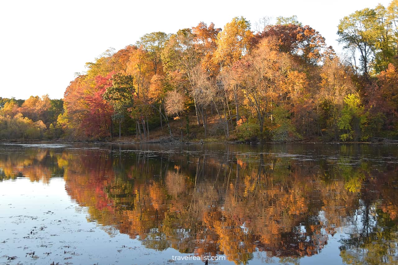 Fall color reflects in Speedwell Lake Park in Morristown, New Jersey, US