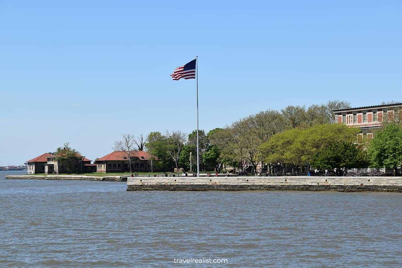 US flag near Ellis Island National Museum of Immigration and Immigrant Hospital in New Jersey, US