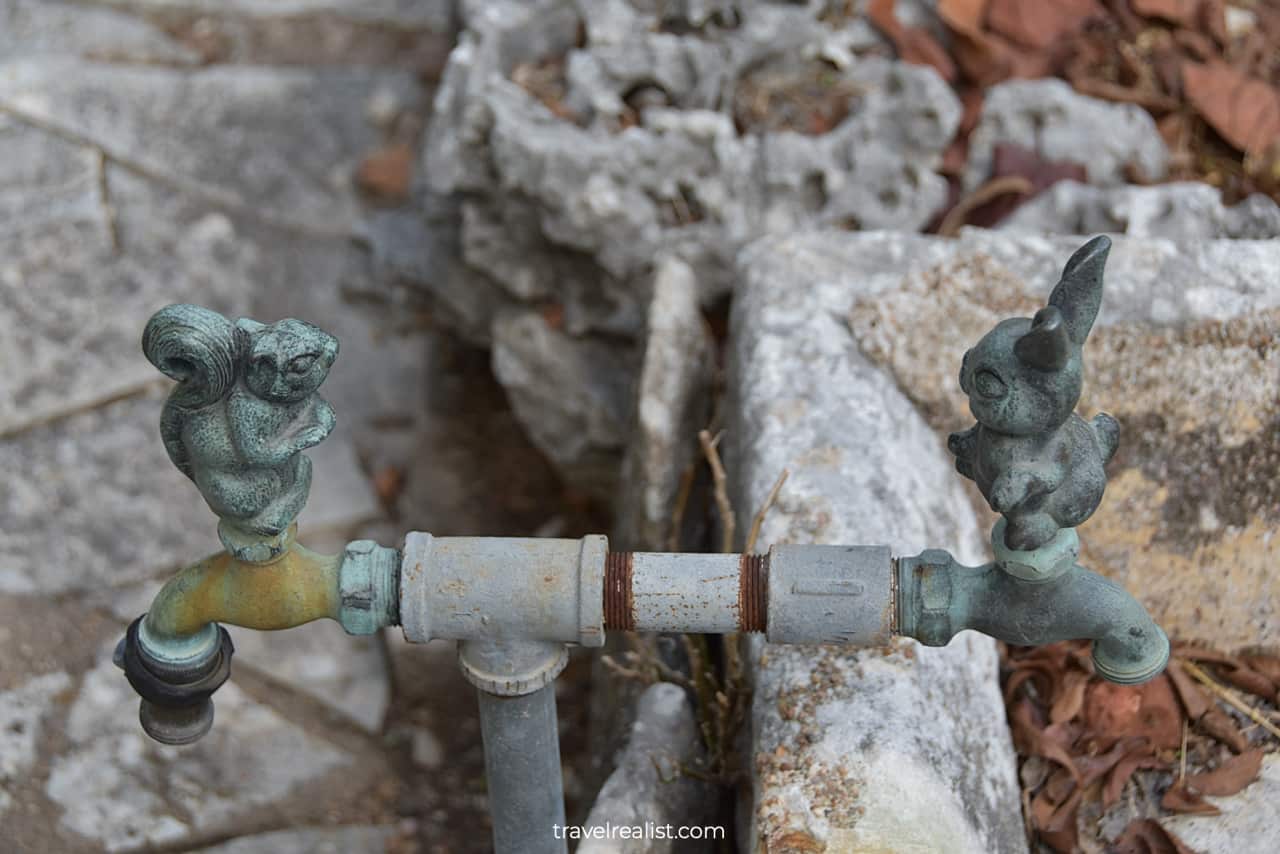 Rabbit and squirrel metal outdoor spigots in Flower Hill Urban Homestead museum in Austin, Texas, US