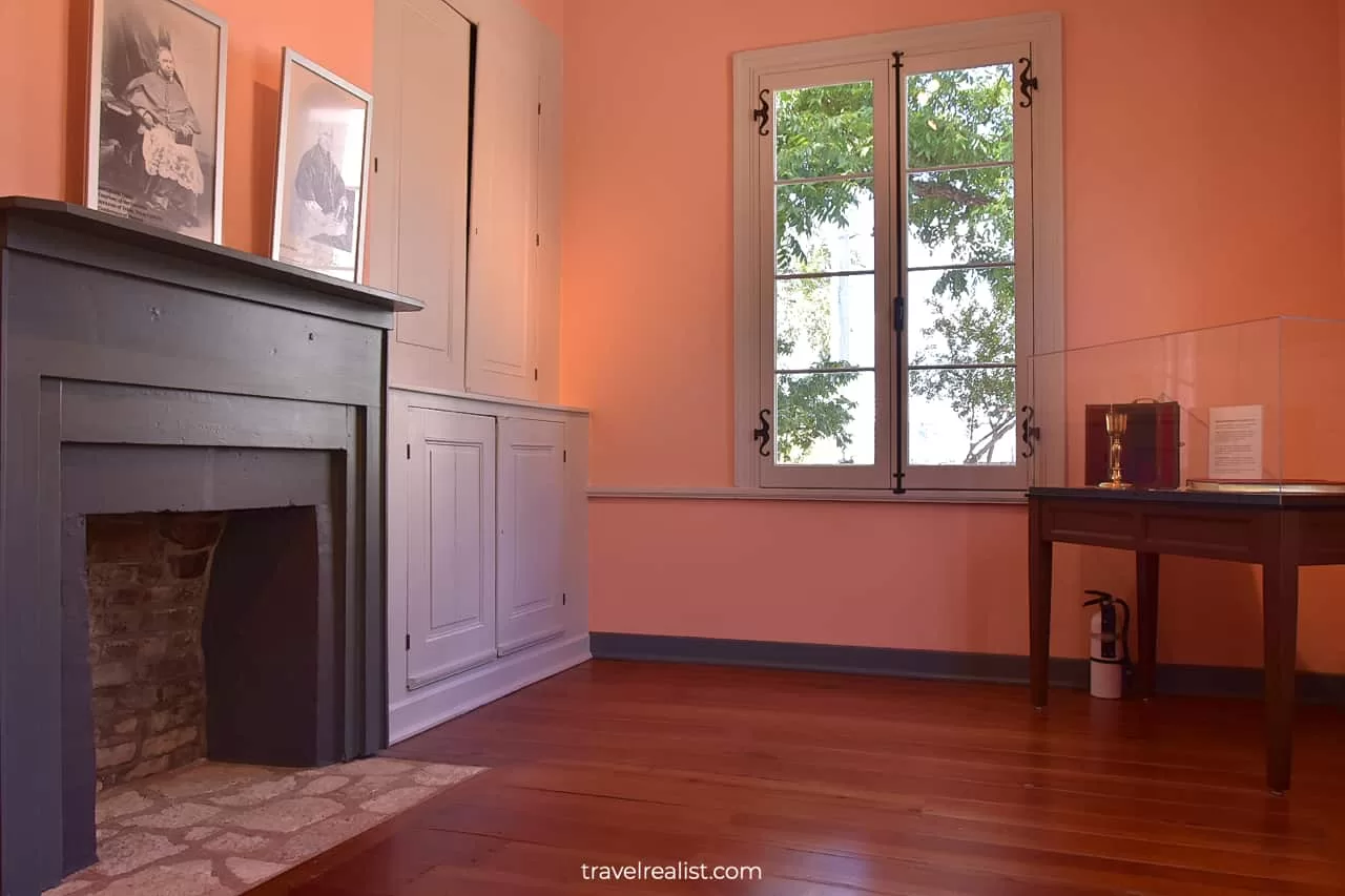 Fireplace and display case in French Legation State Historic Site in Austin, Texas, US