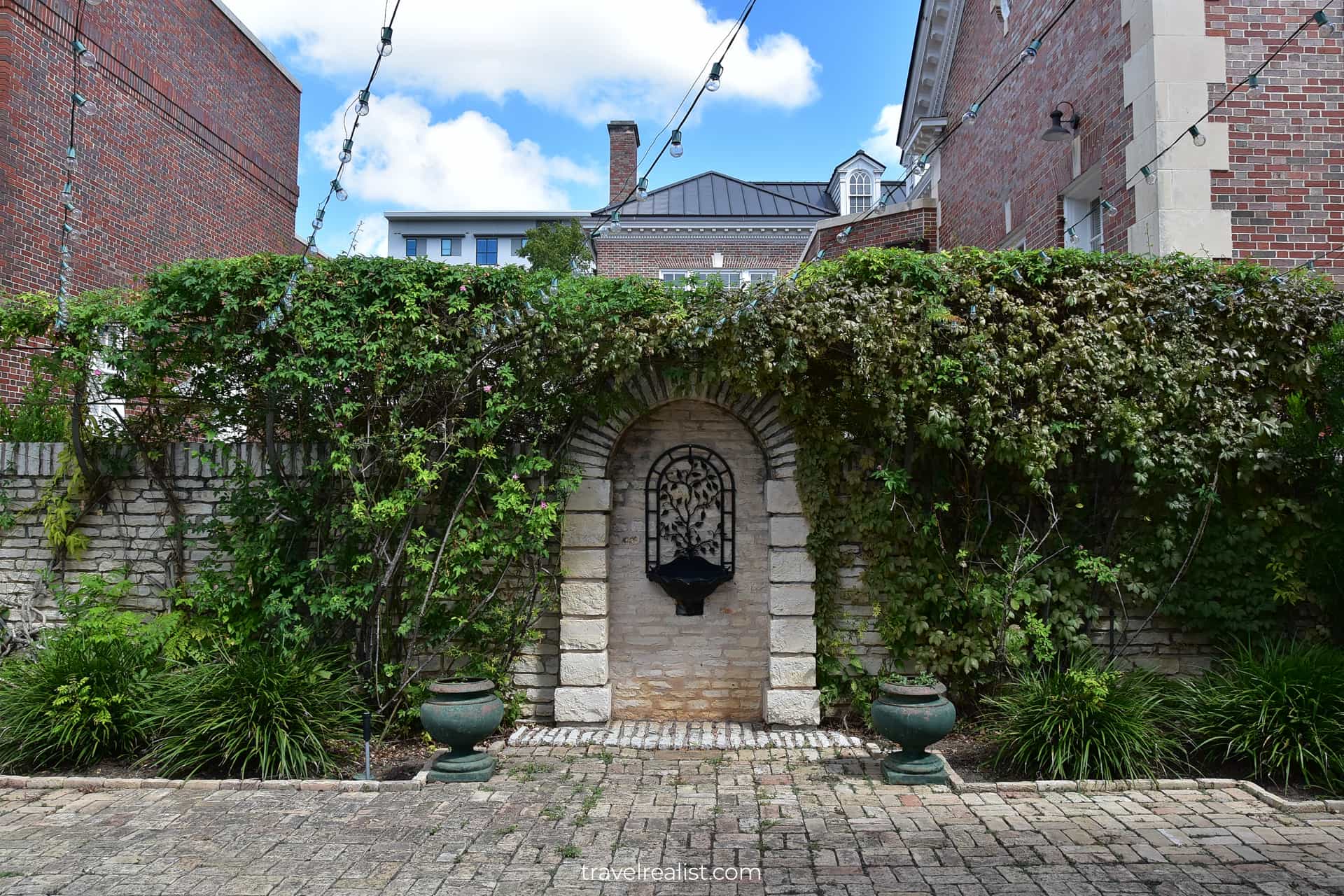 Stone fence and ferns at Neill-Cochran House Museum in Austin, Texas, US