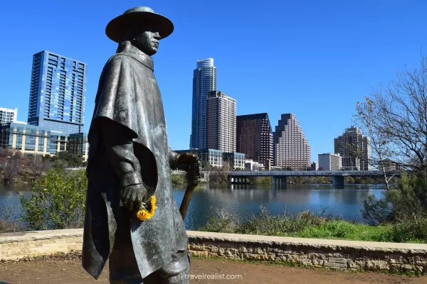 Stevie Ray Vaughan Statue and Austin Skyline from Butler Hike and Bike Trail in Austin, Texas, US