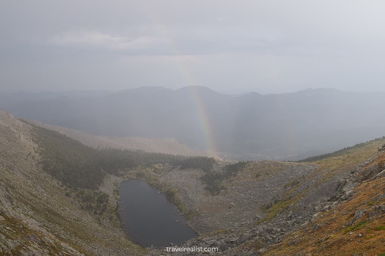 Rainbow at Lincoln Lake on Mount Evans Scenic Byway in Colorado, US