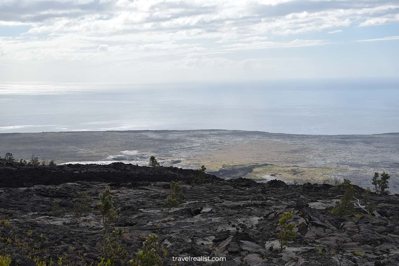 Lava flows and Pacific Ocean in Hawaii Volcanoes National Park on Big Island in Hawaii, US